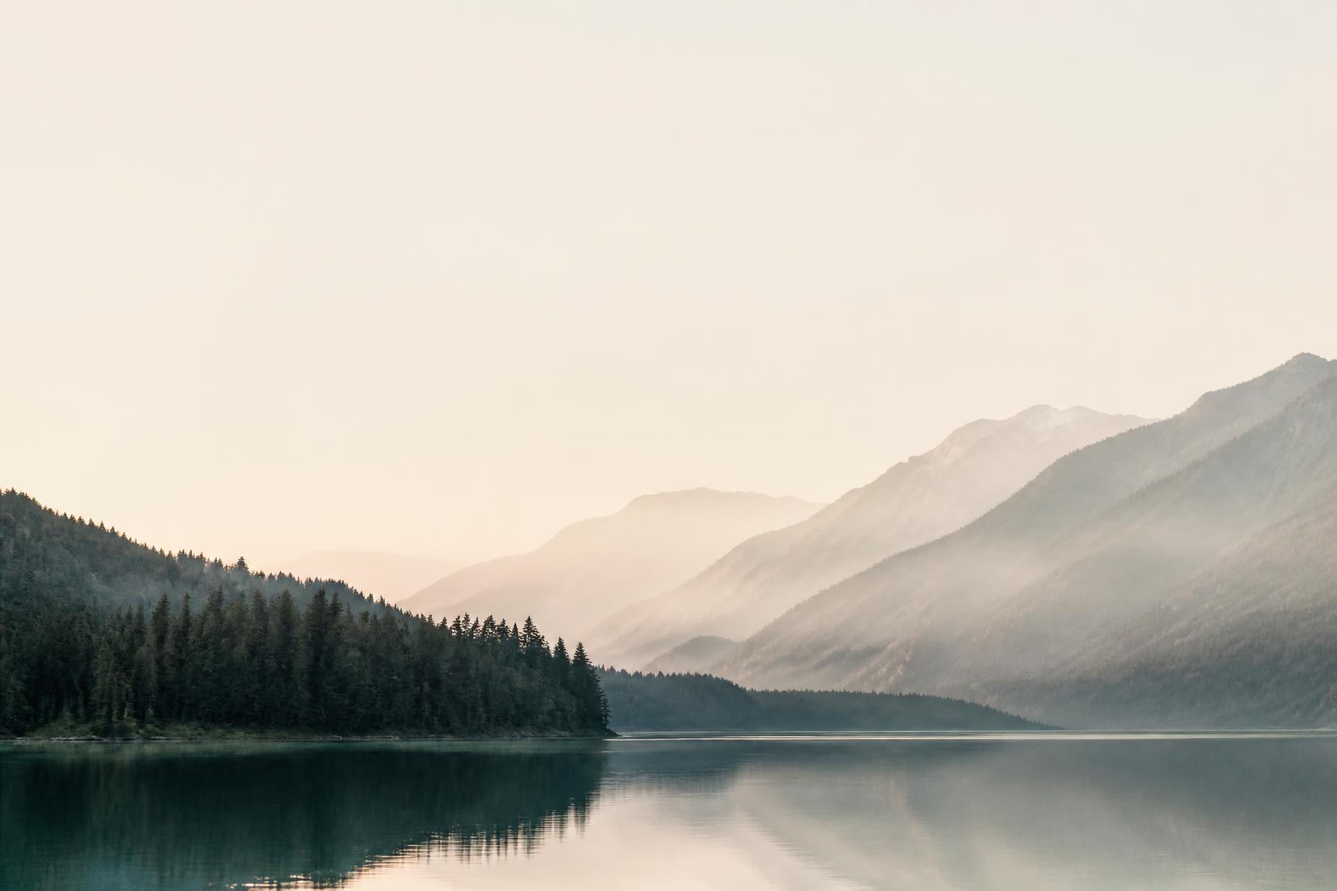 Still mountain lake at dawn